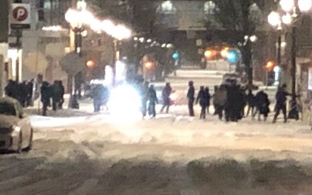 Police say they were “pelted by icy snowballs” during Friday night protest